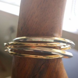 Gold and Silver colored 1 1/2 inch hoop Earring.